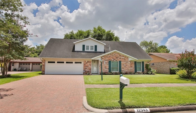 view of front of property with a front lawn and a garage