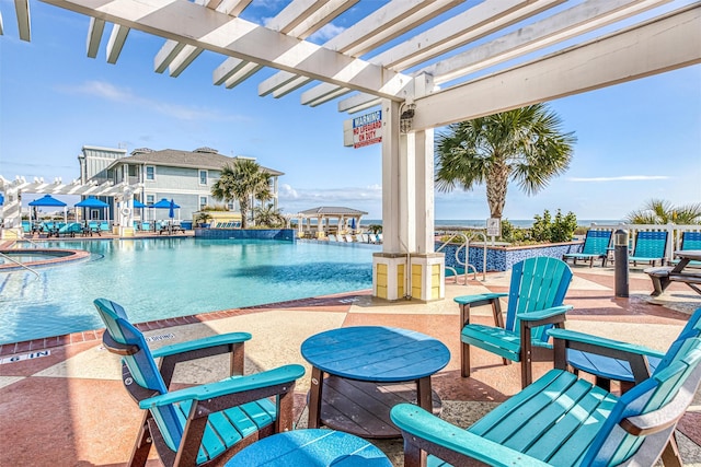 view of pool featuring a pergola and a patio area