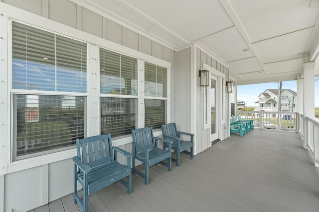 wooden terrace with a porch