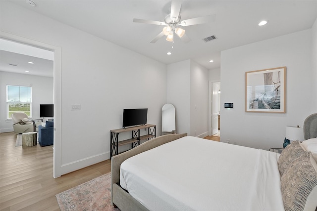 bedroom featuring ceiling fan and light hardwood / wood-style flooring