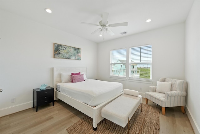 bedroom featuring ceiling fan and light hardwood / wood-style floors