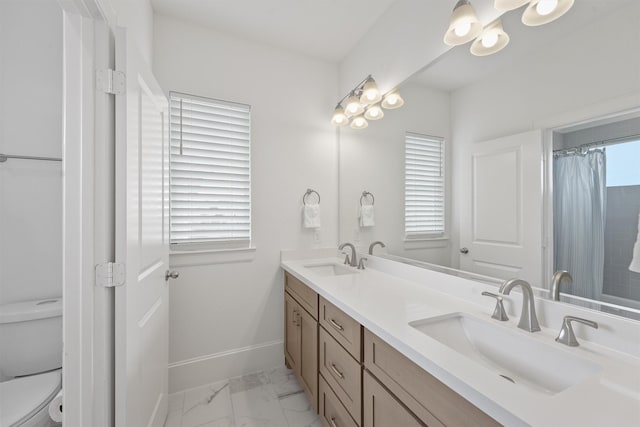 bathroom with vanity and toilet