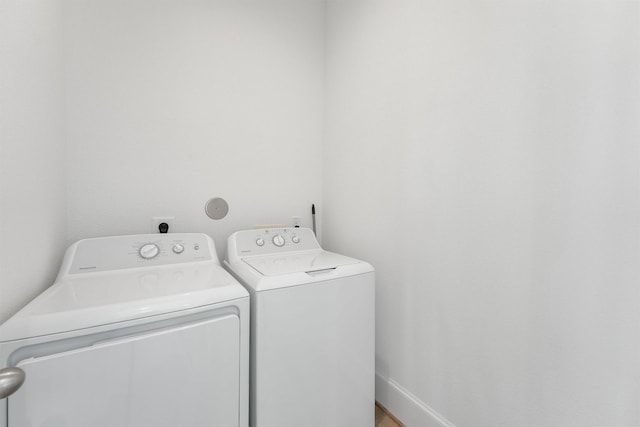 laundry area with washer and clothes dryer