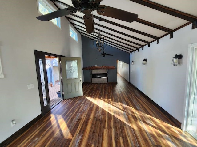 unfurnished living room featuring ceiling fan, high vaulted ceiling, dark hardwood / wood-style floors, and beam ceiling