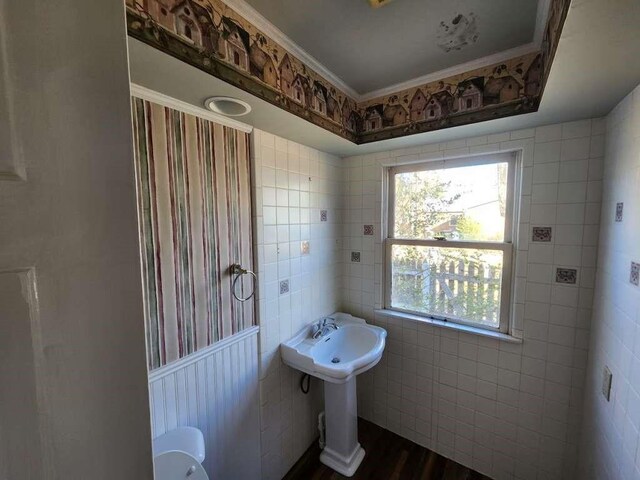 bathroom with tile walls