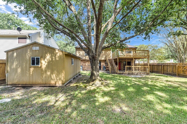 view of yard with an outbuilding and a deck