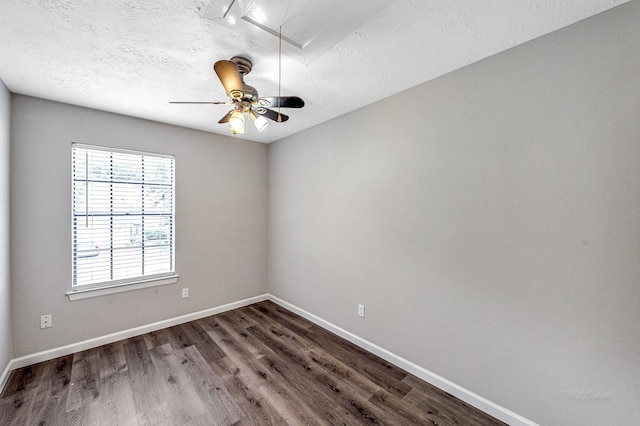 spare room featuring hardwood / wood-style floors, ceiling fan, and a textured ceiling