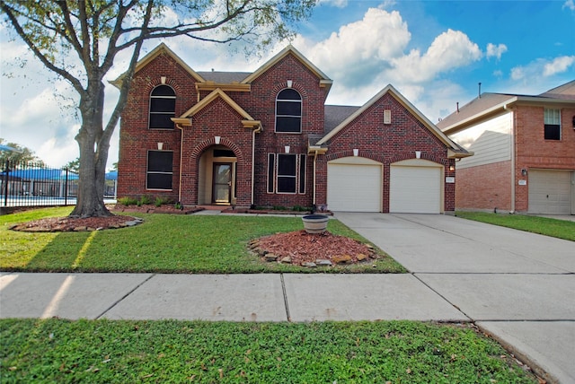 front of property featuring a front yard and a garage