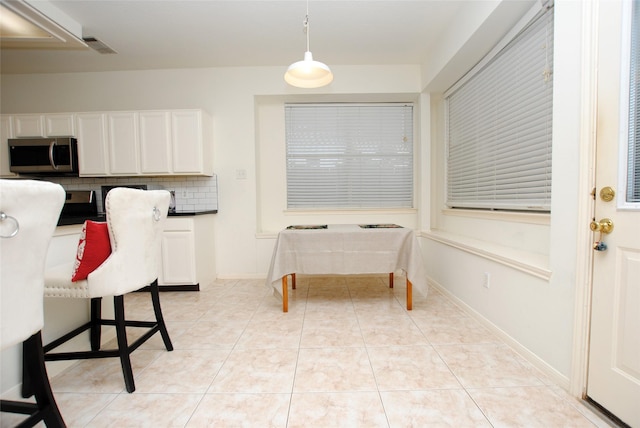 interior space with light tile patterned floors