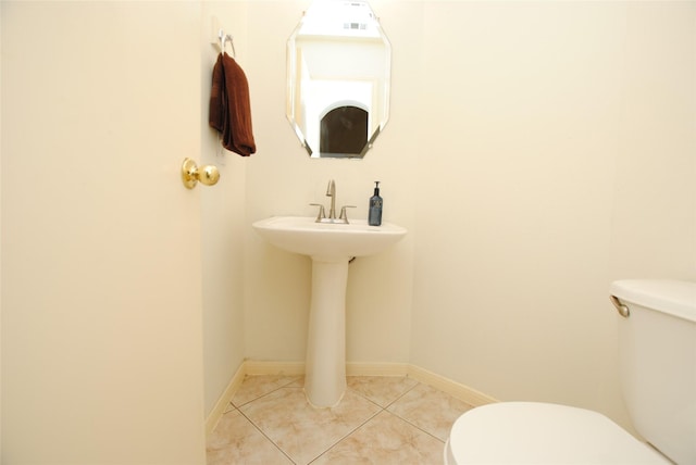 bathroom featuring tile patterned floors and toilet