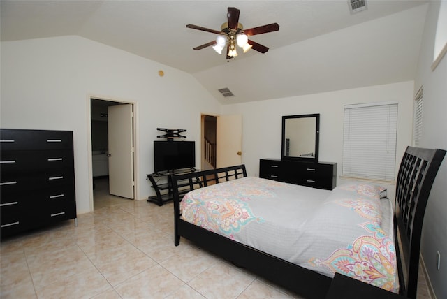 tiled bedroom with ceiling fan and vaulted ceiling