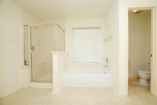 bathroom with tile patterned floors, separate shower and tub, and toilet