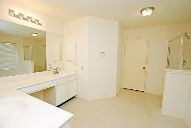 bathroom with a shower with door and vanity