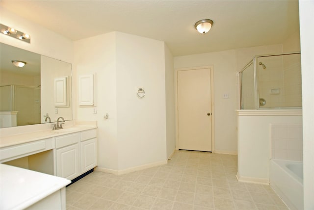 bathroom with vanity and independent shower and bath