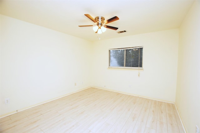 spare room featuring ceiling fan and light hardwood / wood-style floors