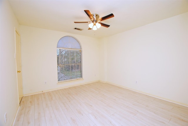 spare room featuring ceiling fan and light hardwood / wood-style floors