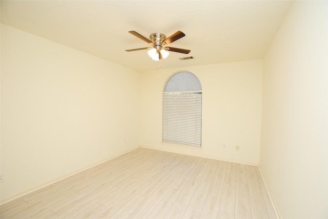 unfurnished room with ceiling fan and light wood-type flooring