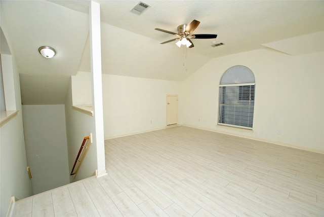 interior space with ceiling fan, light hardwood / wood-style flooring, and vaulted ceiling