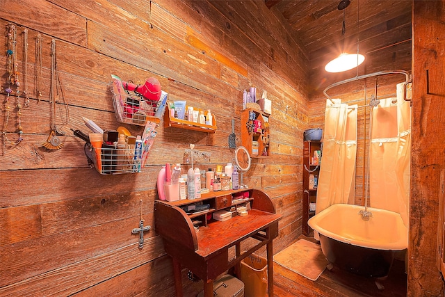 bathroom with plus walk in shower, wood walls, and wood-type flooring