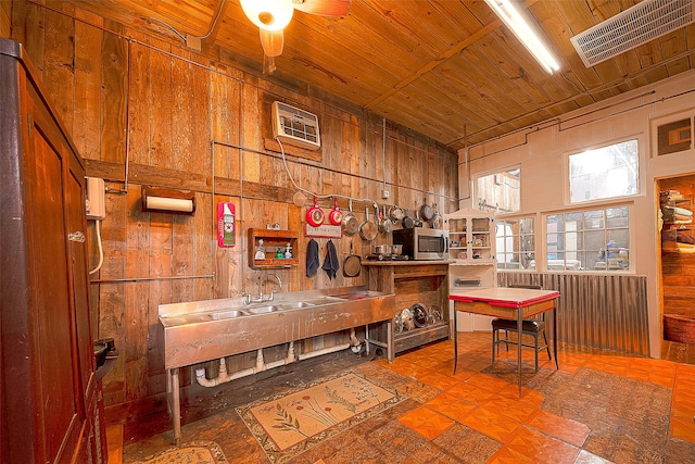 tiled dining area with wooden ceiling, ceiling fan, and wooden walls