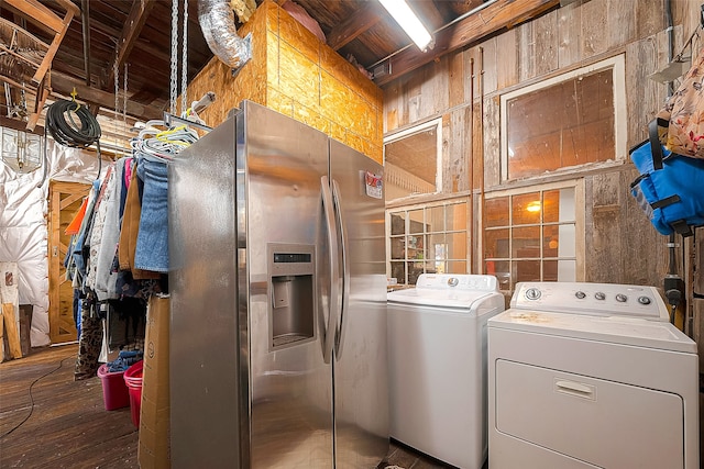 laundry room featuring washing machine and dryer and dark hardwood / wood-style flooring