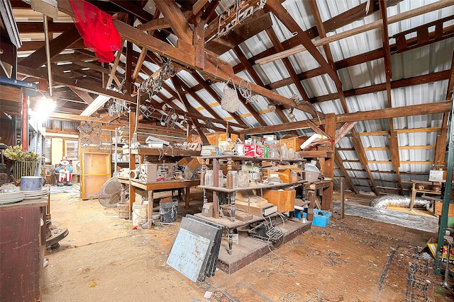 miscellaneous room with a workshop area and lofted ceiling with beams