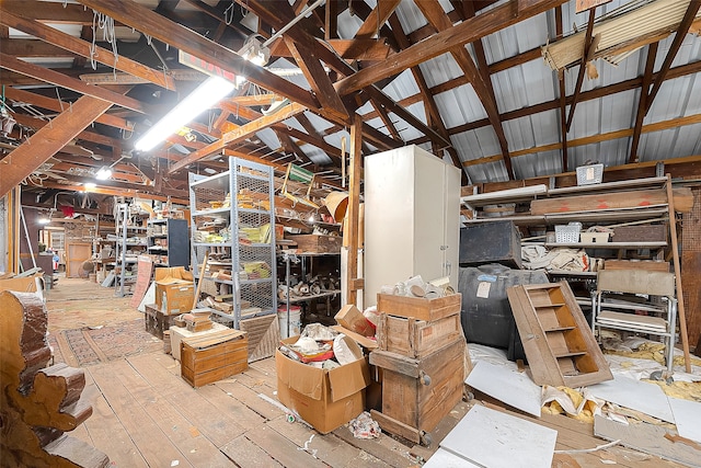 interior space with high vaulted ceiling, beamed ceiling, and light wood-type flooring