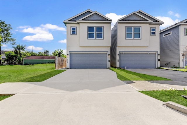 view of front facade featuring a front yard and a garage