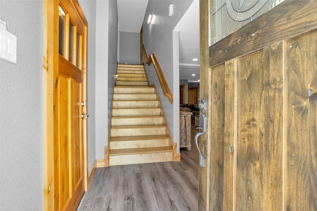 foyer entrance with hardwood / wood-style floors