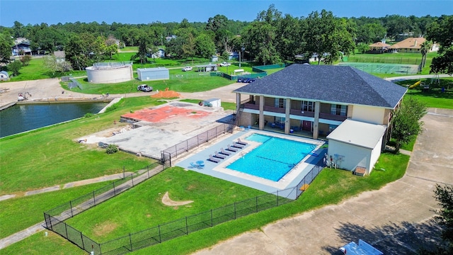 birds eye view of property with a water view