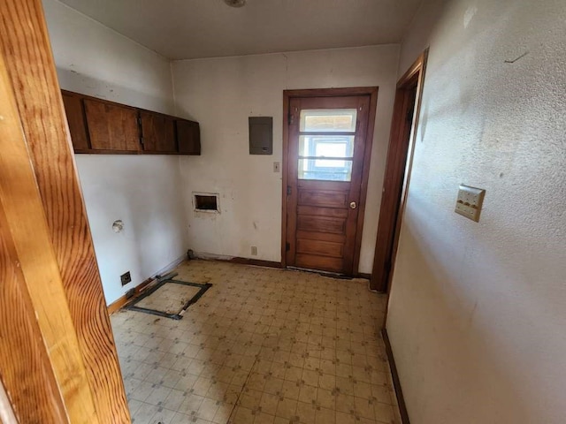 clothes washing area with cabinets, light tile floors, and hookup for a washing machine