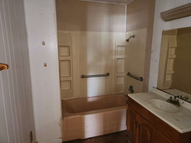 bathroom featuring washtub / shower combination and vanity