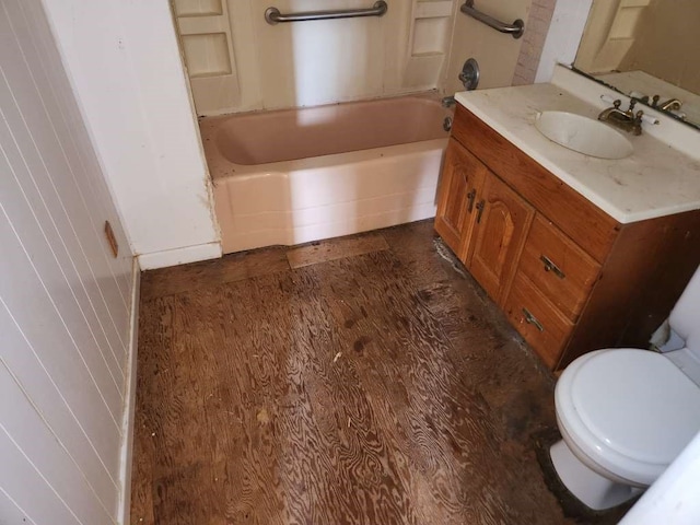 full bathroom featuring bathtub / shower combination, hardwood / wood-style floors, toilet, and vanity