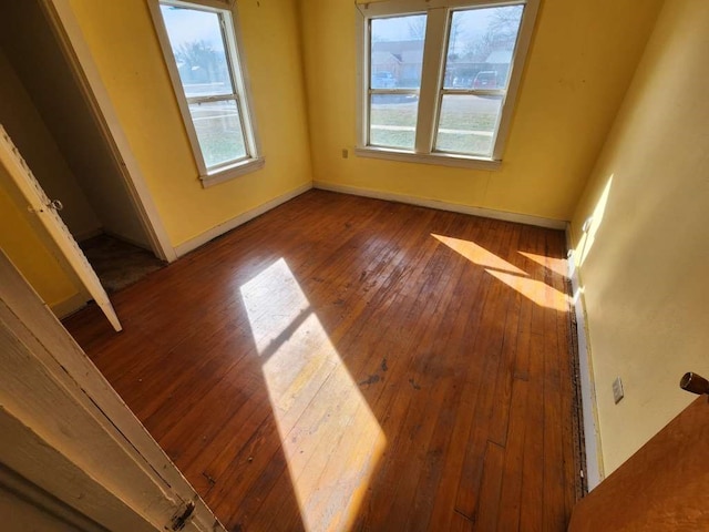 spare room with hardwood / wood-style floors