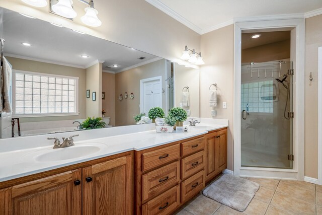 bathroom with tile patterned flooring, vanity, a shower with door, and ornamental molding