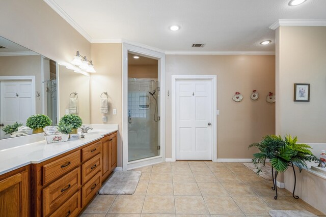 bathroom with tile patterned floors, vanity, crown molding, and walk in shower