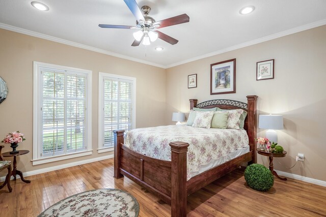 bedroom featuring light wood-type flooring, ceiling fan, and crown molding