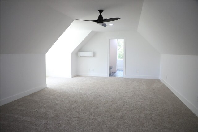 bonus room with a wall mounted AC, ceiling fan, carpet floors, and lofted ceiling