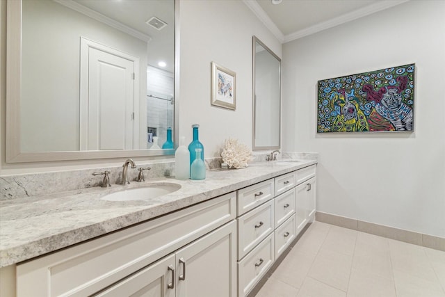 bathroom featuring vanity, crown molding, and tile patterned flooring