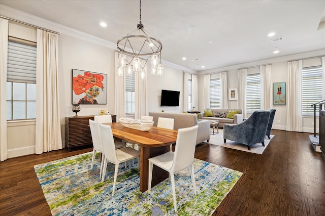 dining space featuring dark hardwood / wood-style flooring and crown molding