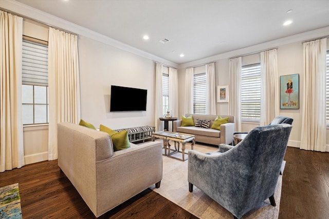 living room with dark wood-type flooring and ornamental molding