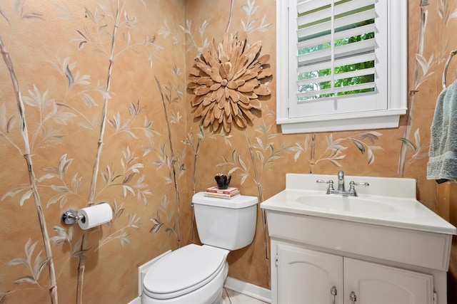 bathroom with toilet and vanity