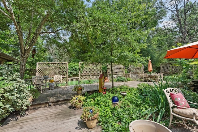 view of yard featuring a wooden deck