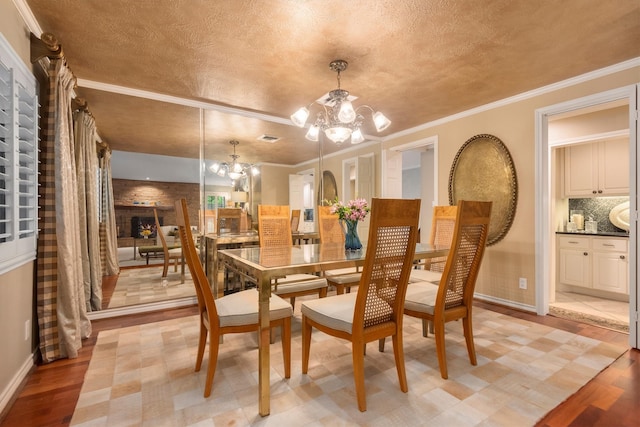 tiled dining area with a notable chandelier and ornamental molding