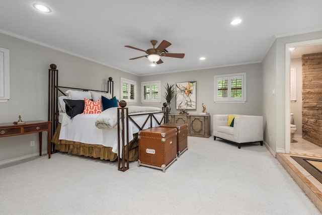 bedroom with light carpet, connected bathroom, ceiling fan, and crown molding