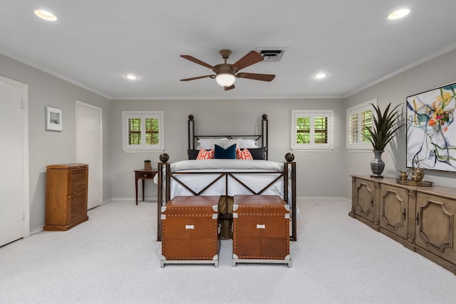 carpeted bedroom featuring ornamental molding and ceiling fan