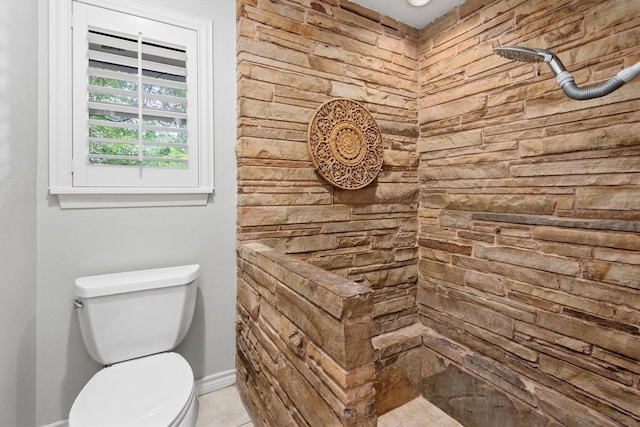 bathroom featuring walk in shower and toilet