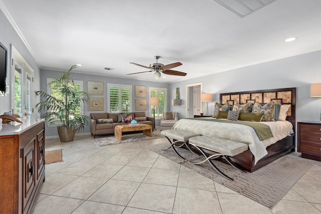 bedroom featuring ceiling fan, light tile floors, and crown molding