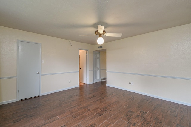 unfurnished room with dark hardwood / wood-style flooring and ceiling fan