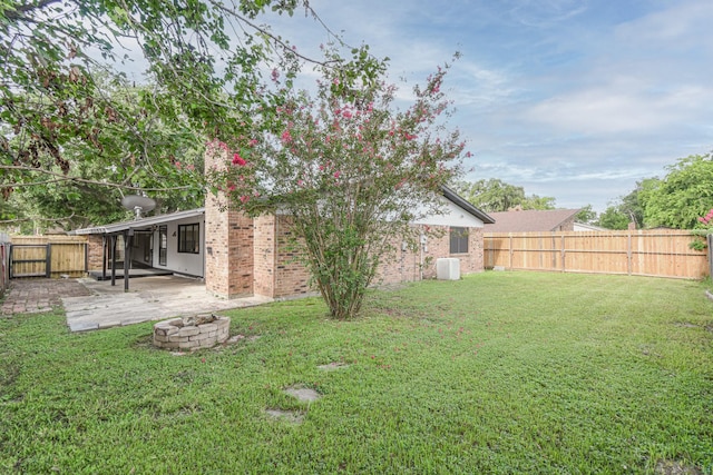 view of yard featuring a patio area and a fire pit